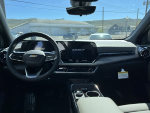 Interior image of the 2026 Equinox steering wheel and infotainment system