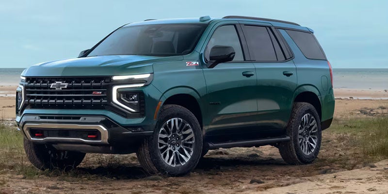 chevrolet Suburban parked near coastline